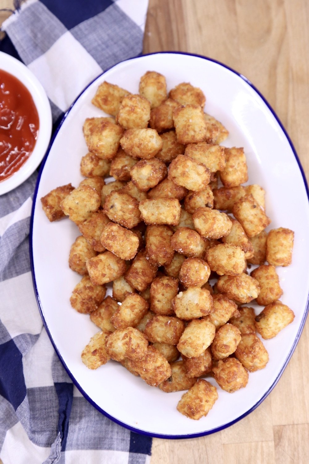 Tater tots on a platter served with ketchup