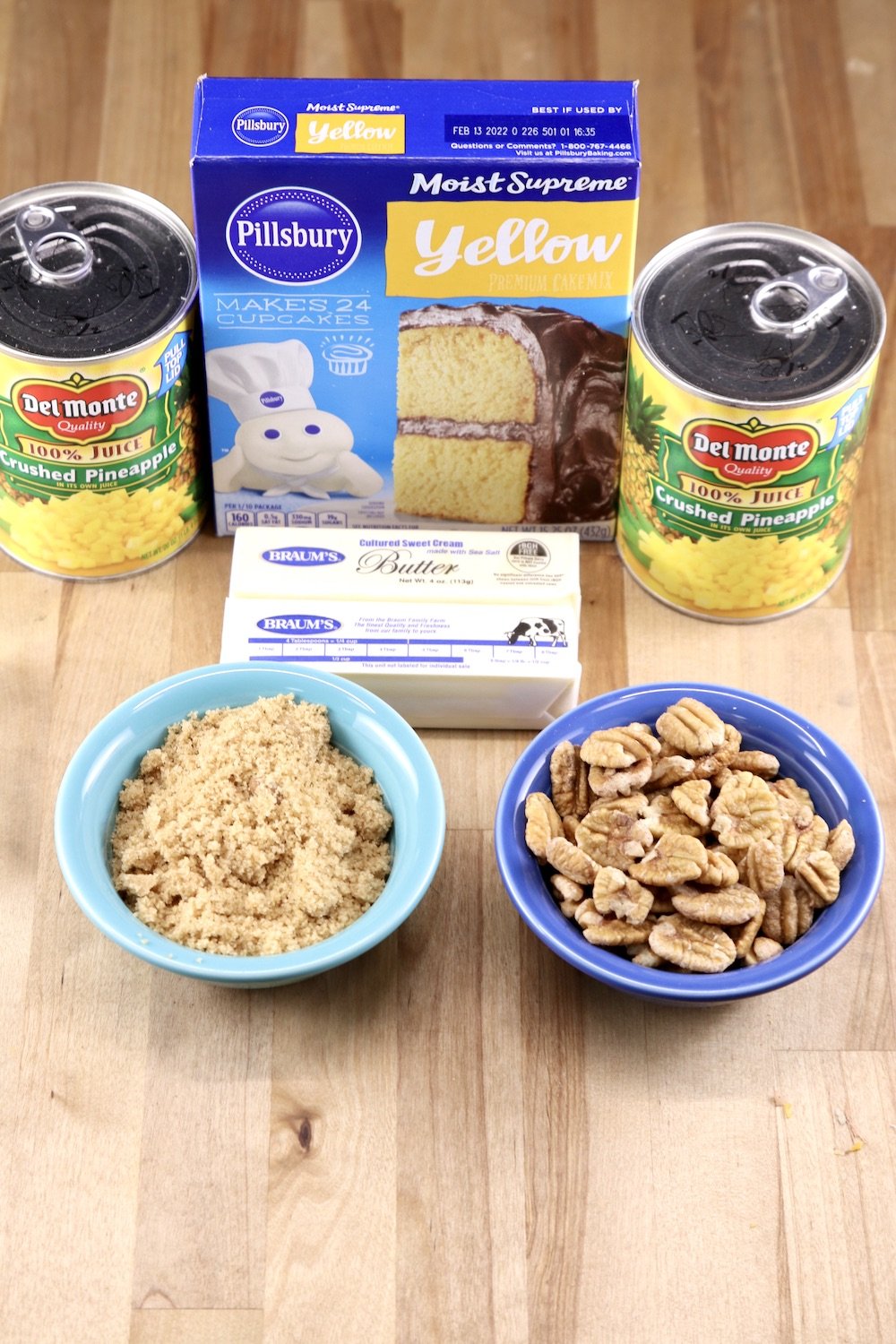 Dump Cake Ingredients: 2 cans crushed pineapple, yellow cake mix, brown sugar, butter, pecans