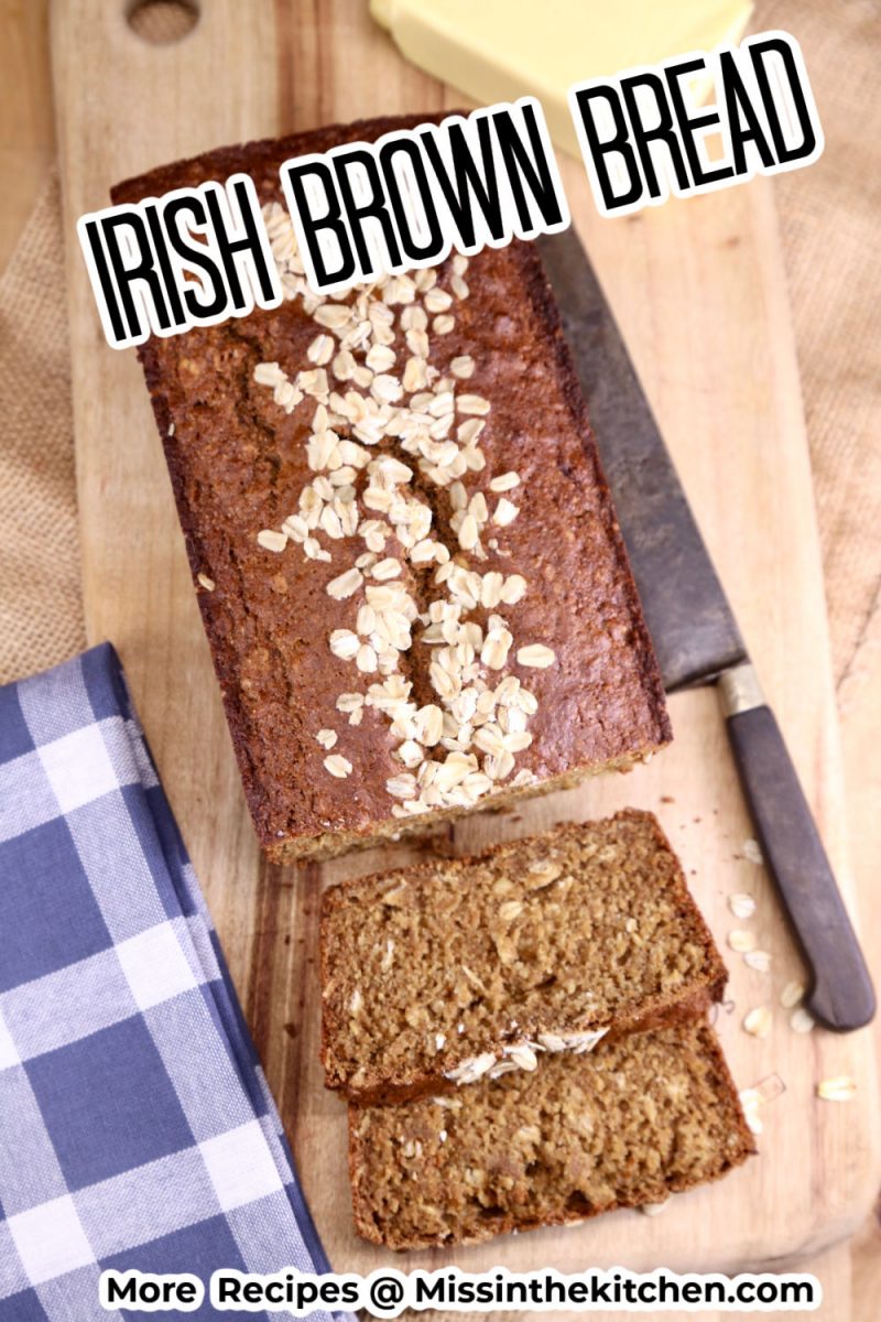 Irish brown bread loaf on a cutting board with knife and butter