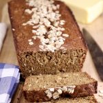 Irish Brown Bread loaf with oat topping - 2 slices off of loaf