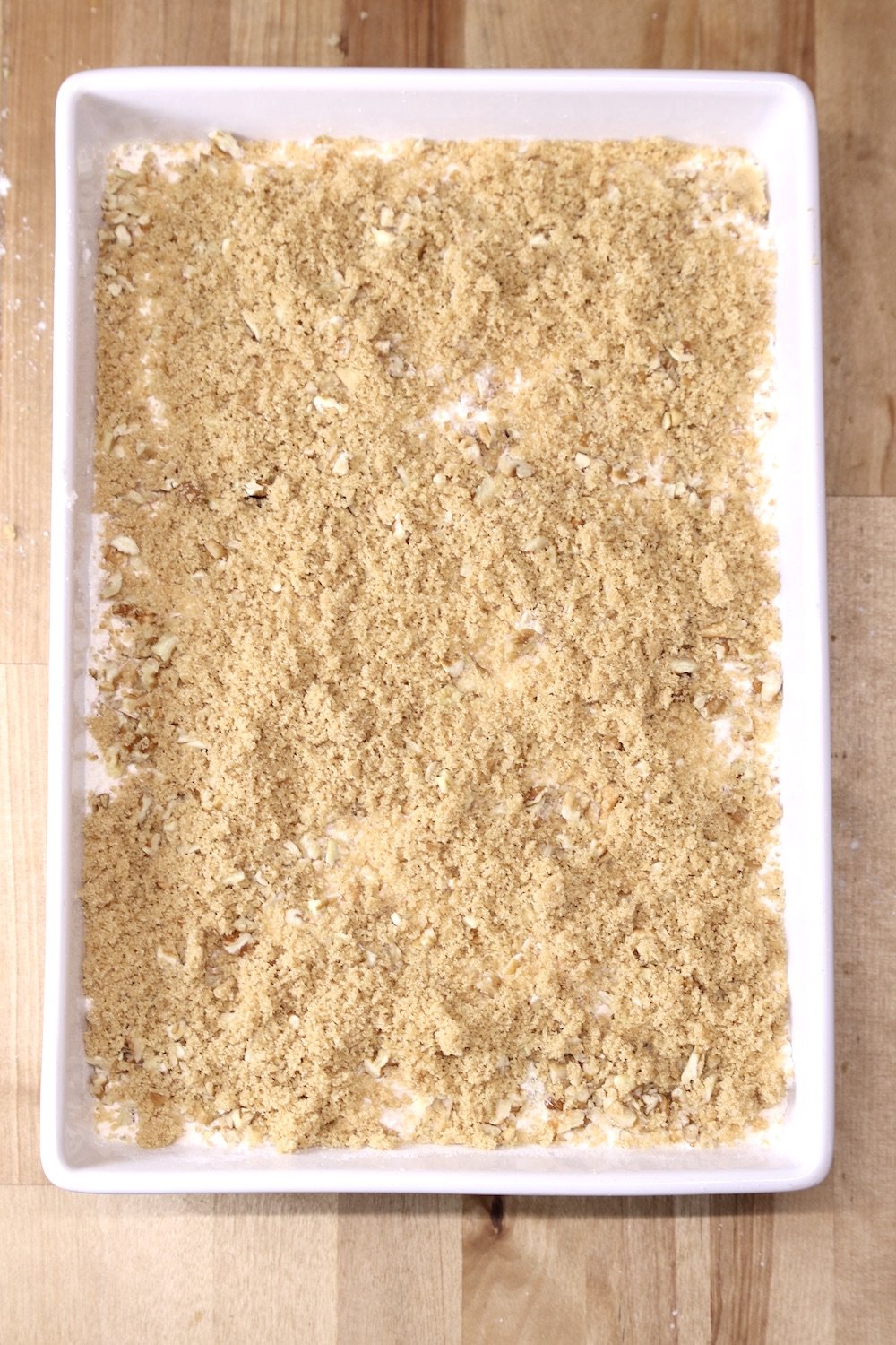 dump cake sprinkled with brown sugar layer
