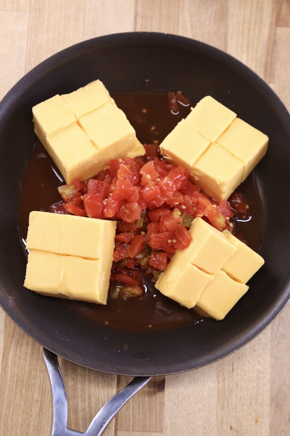 chunks of Velveeta with RoTel tomatoes in a non stick skillet