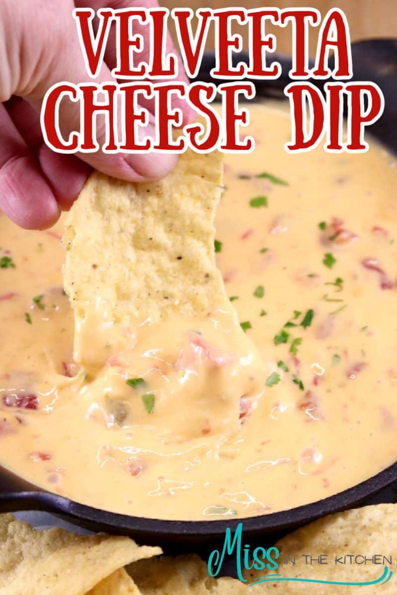 Velveeta Cheese dip with chip dipping. Text overlay.