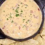 Velveeta Cheese Dip in a small cast iron skillet with chips