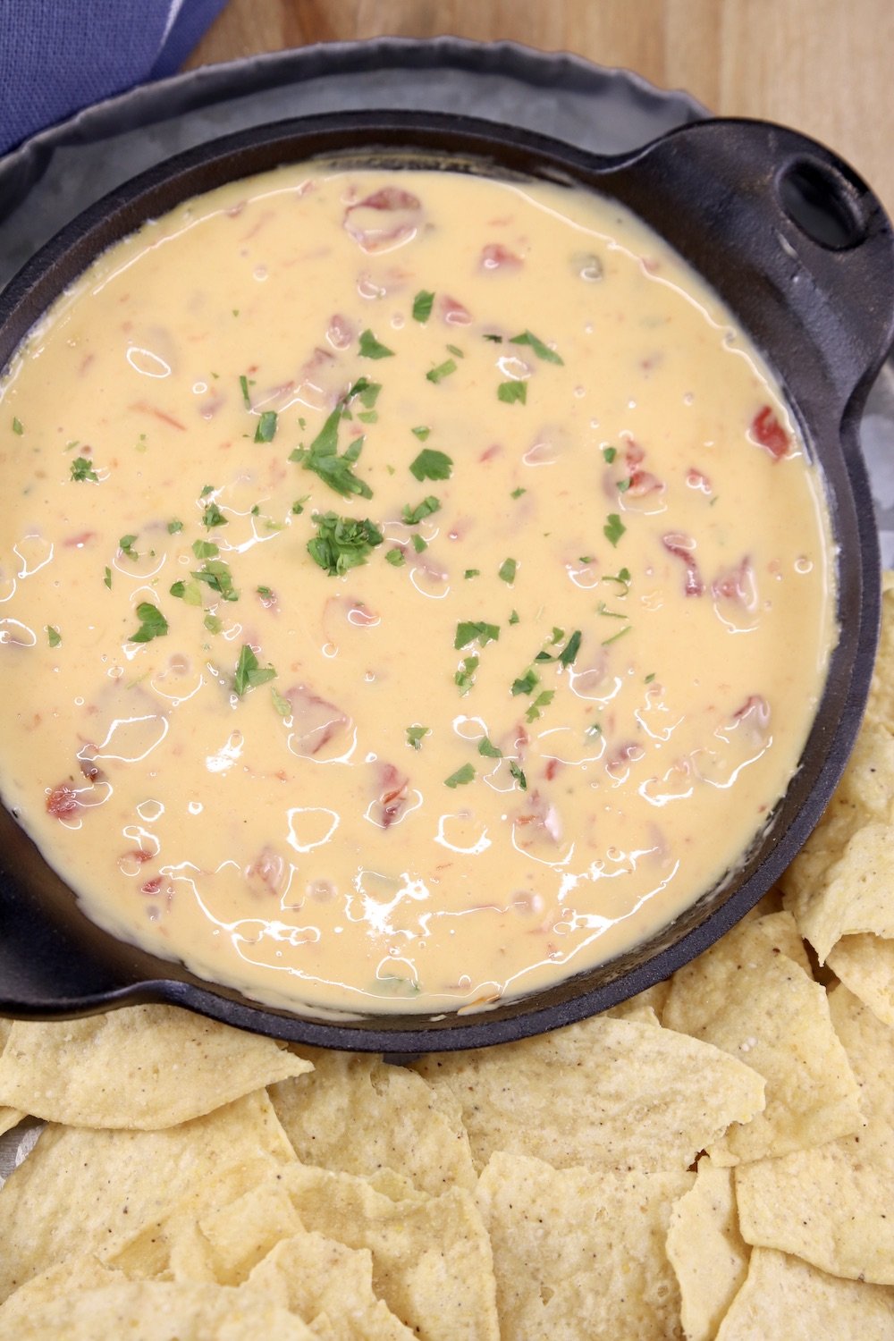 Cheese dip in a small cast iron skillet with chips