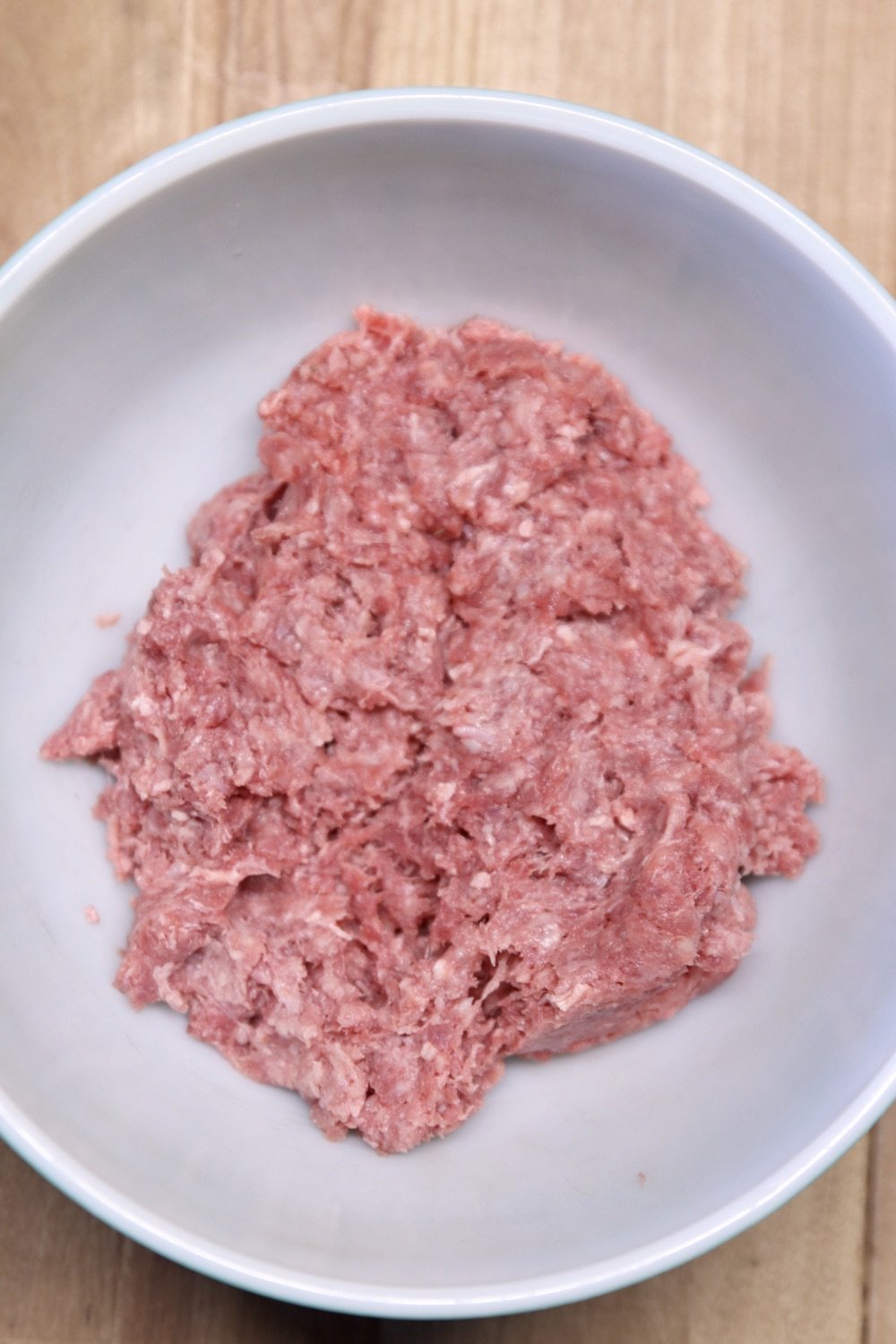 Ground beef in a bowl for making meatballs