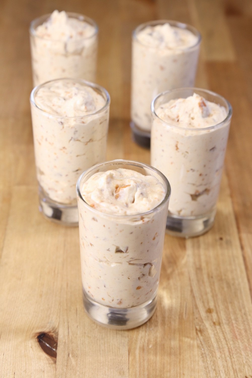individual dessert glasses with Butterfinger cheesecake