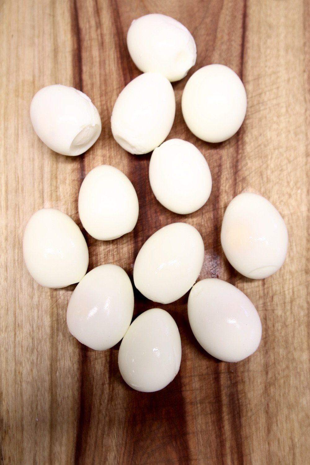 Boiled and peeled eggs on a cutting board