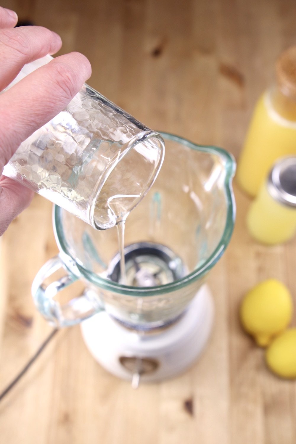 adding simple syrup into a blender