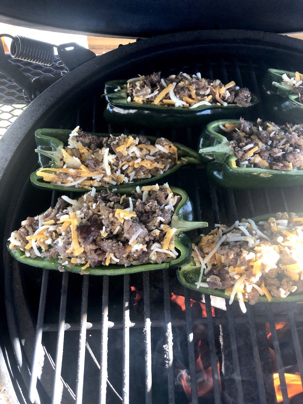 stuffed poblano peppers on a grill