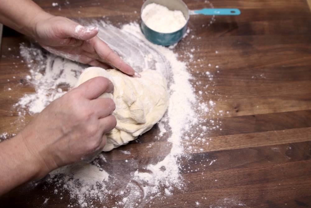 Kneading dough on a floured board