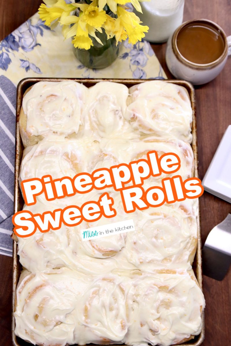 pan of pineapple sweet rolls with cream cheese icing -text overlay