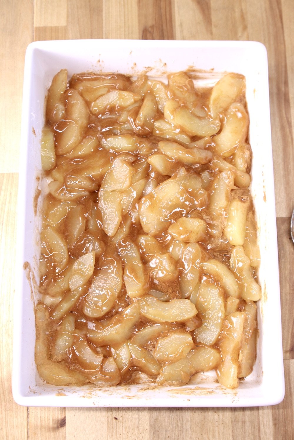 cinnamon apple pie filling in a cake pan