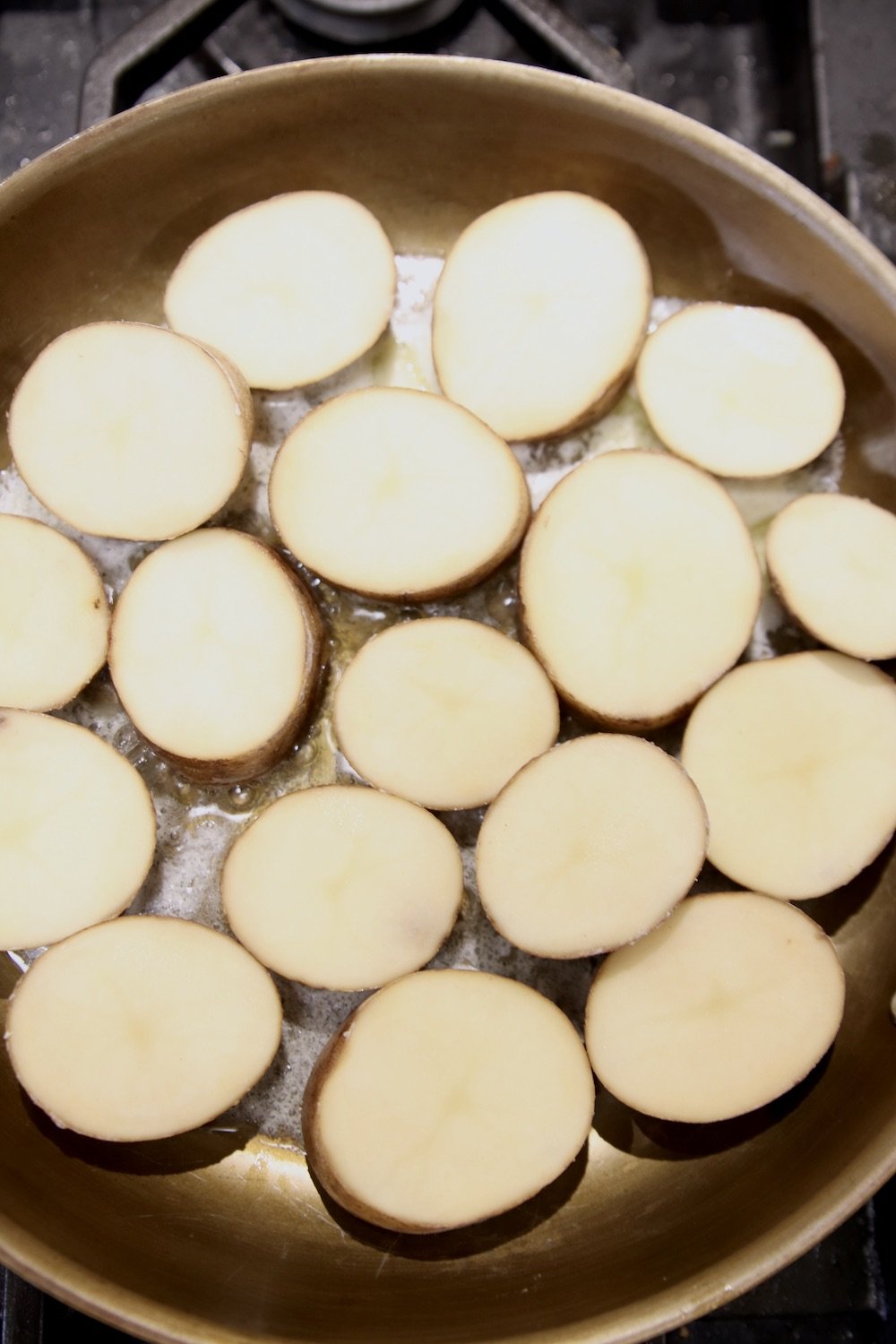 sliced potatoes in a skillet