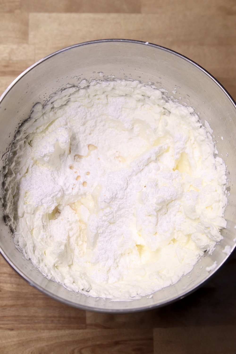 powdered sugar and vanilla in a mixer bowl