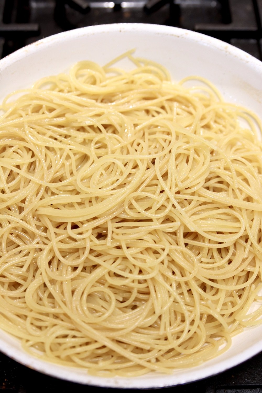 drained spaghetti in a pan
