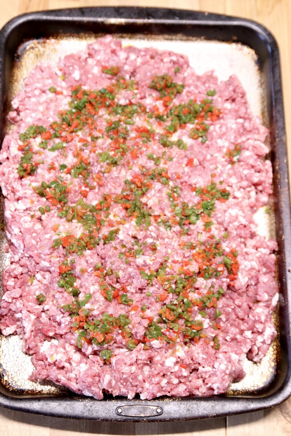 sheet pan of ground pork with chopped peppers