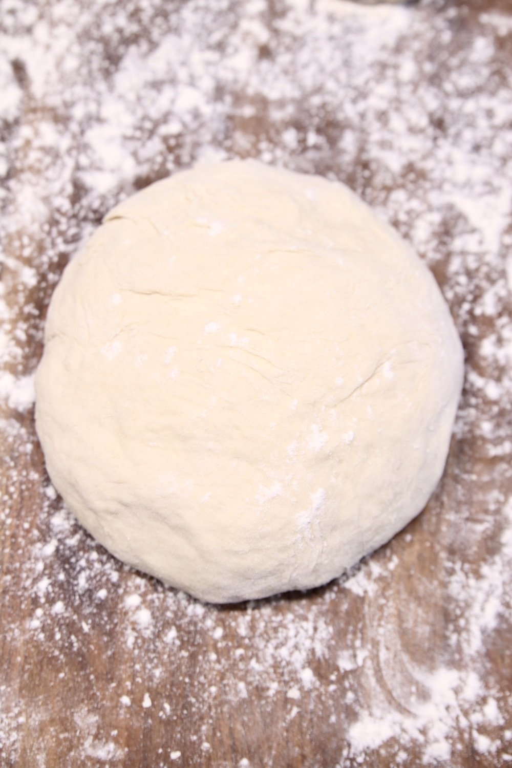 Pizza dough on a floured board