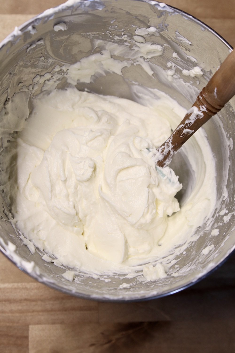 cheesecake filling in a bowl with a spatula