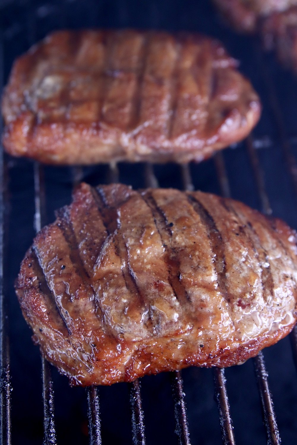 pork chops with grill marks on a grill