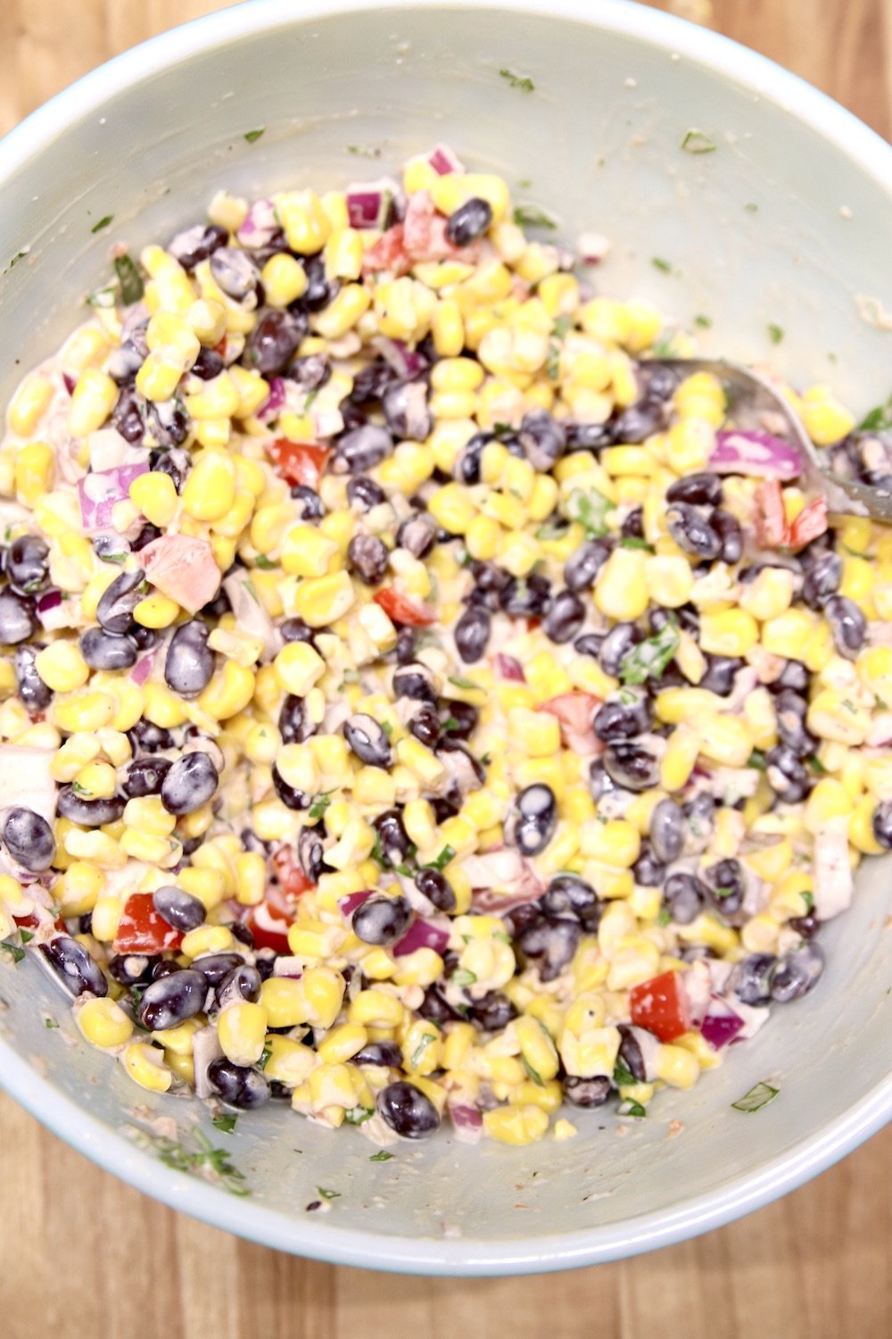 bowl of black bean and corn salad with salsa ranch dressing