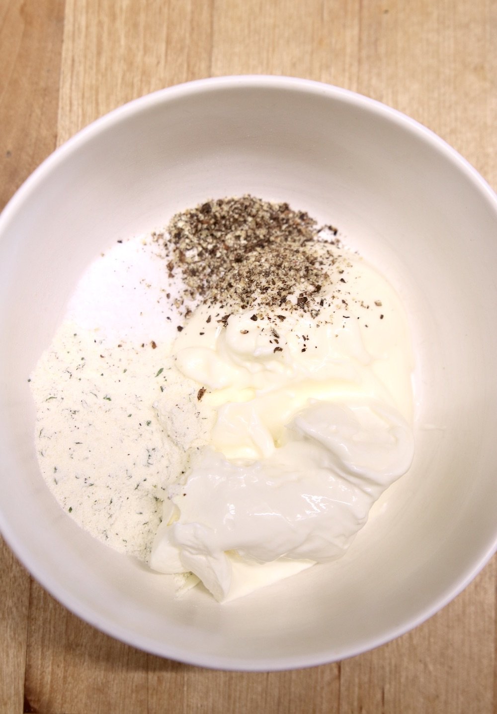 mayo, sour cream, salt and pepper and seasonings in a bowl