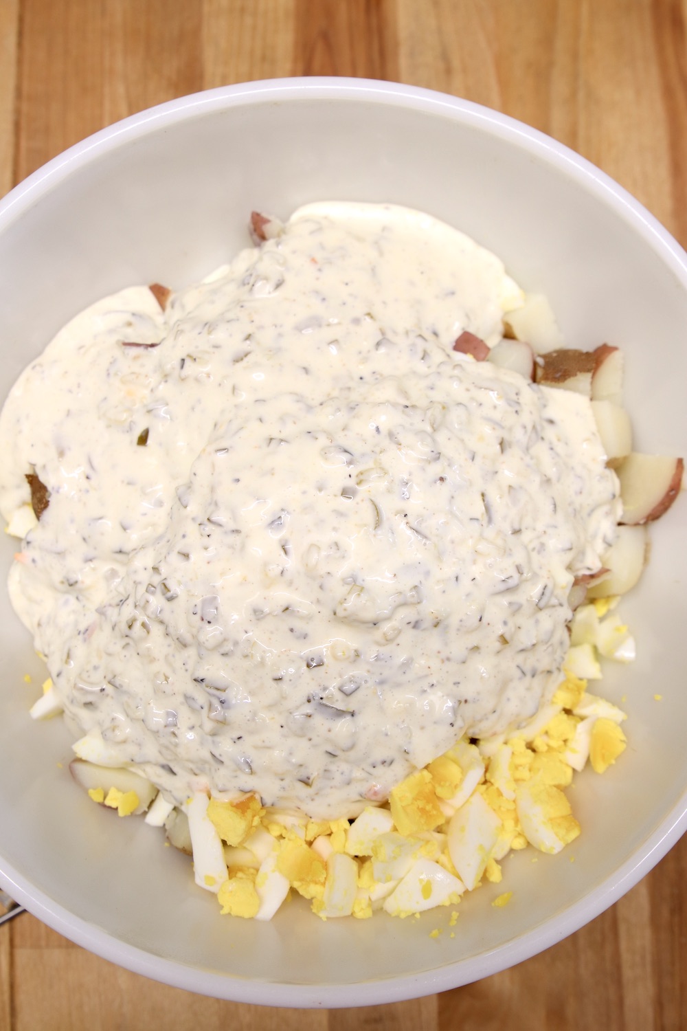 making potato salad with creamy dressing