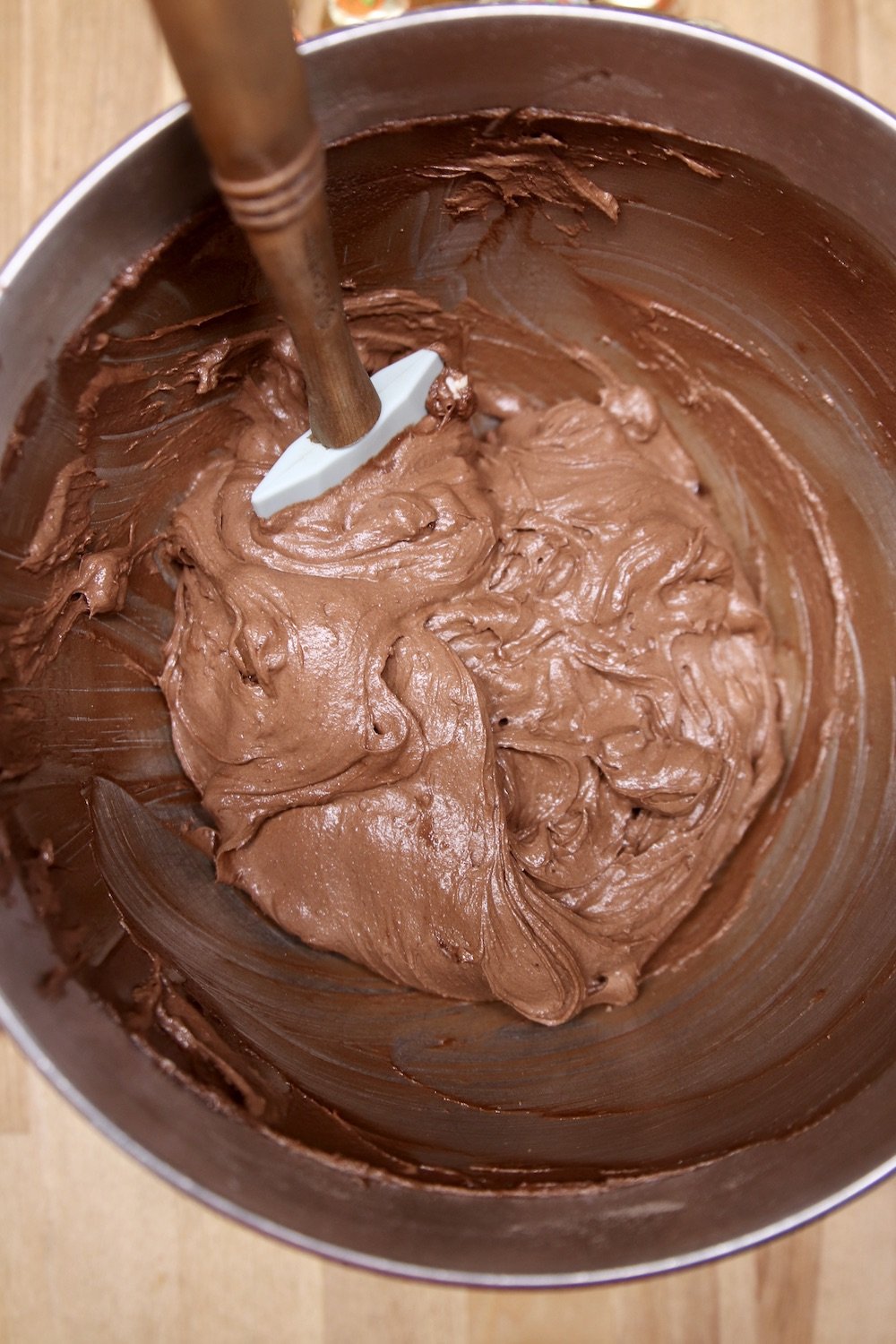 brownie batter with a spatula in a mixer bowl