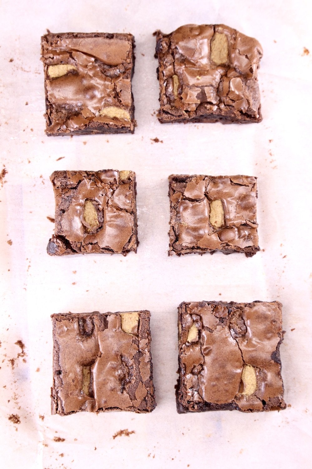 sliced brownies on parchment paper