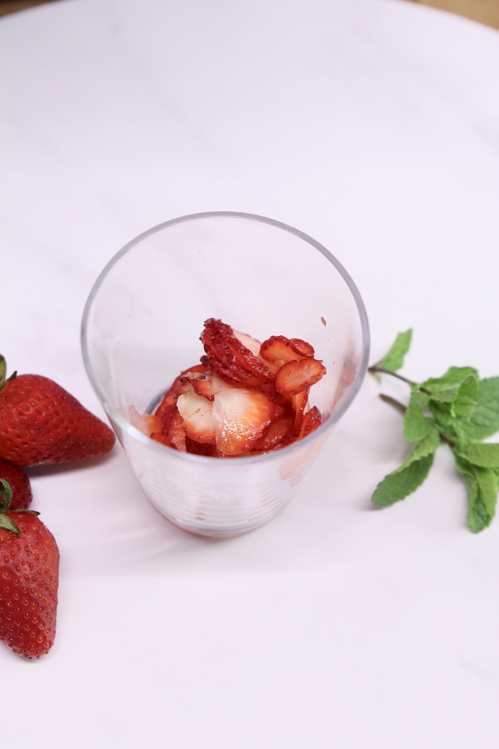 sliced strawberries in a glass for cocktail