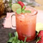 Strawberry Pineapple Mojito with mint, lime and strawberry garnish