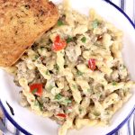 Creamy Italian Sausage Pasta with bell peppers and garlic toast