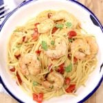 honey garlic shrimp spaghetti with red bell peppers in a bowl