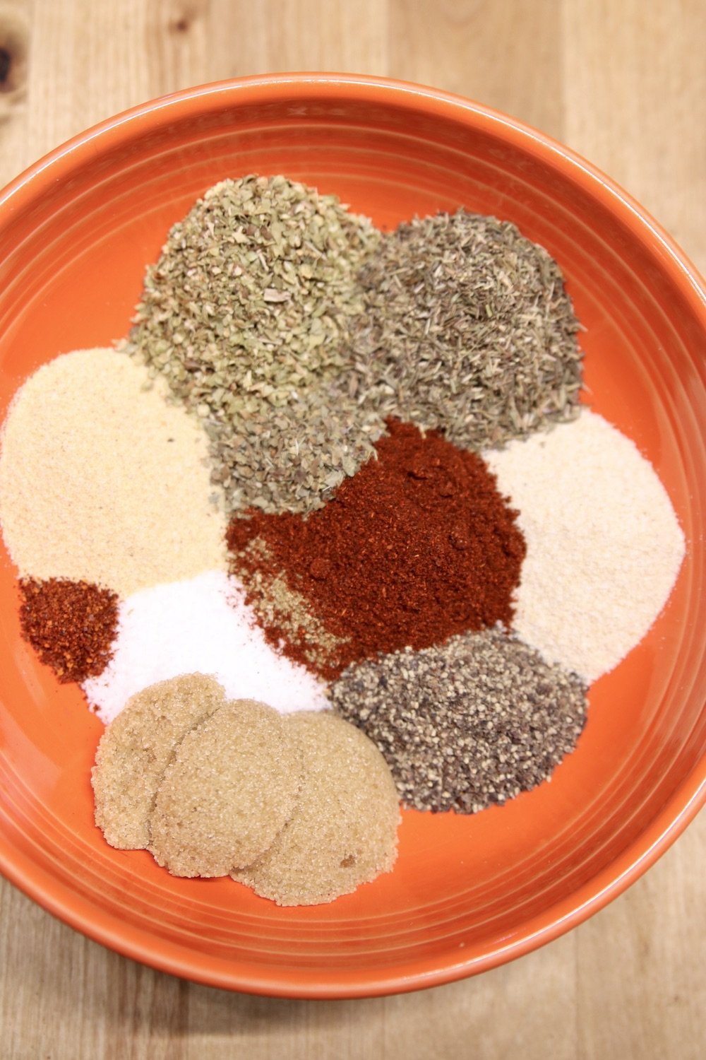 spices and herbs in a bowl for Italian sausage