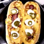 Best Chili Dogs topped with sour cream and candied jalapenos