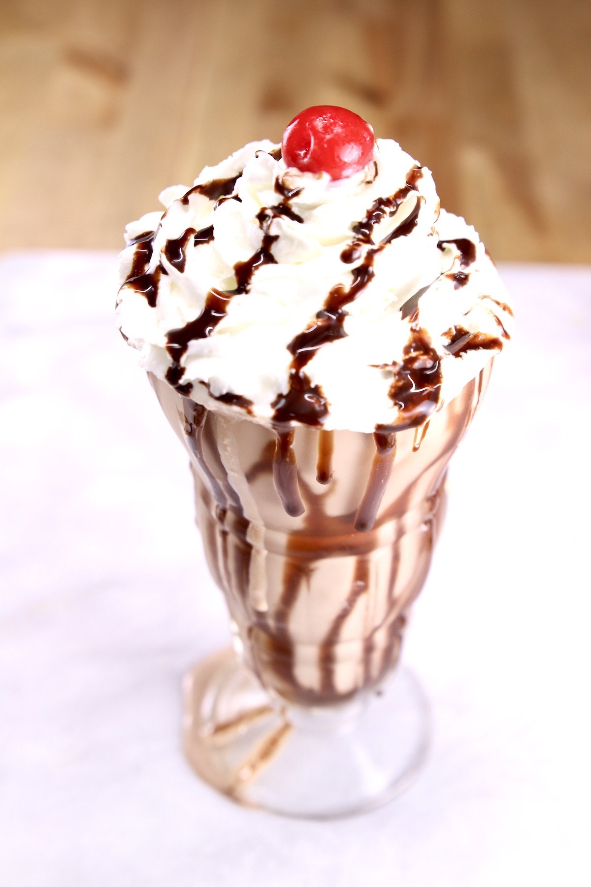 Baileys Chocolate Milkshake with whipped cream and a cherry on top