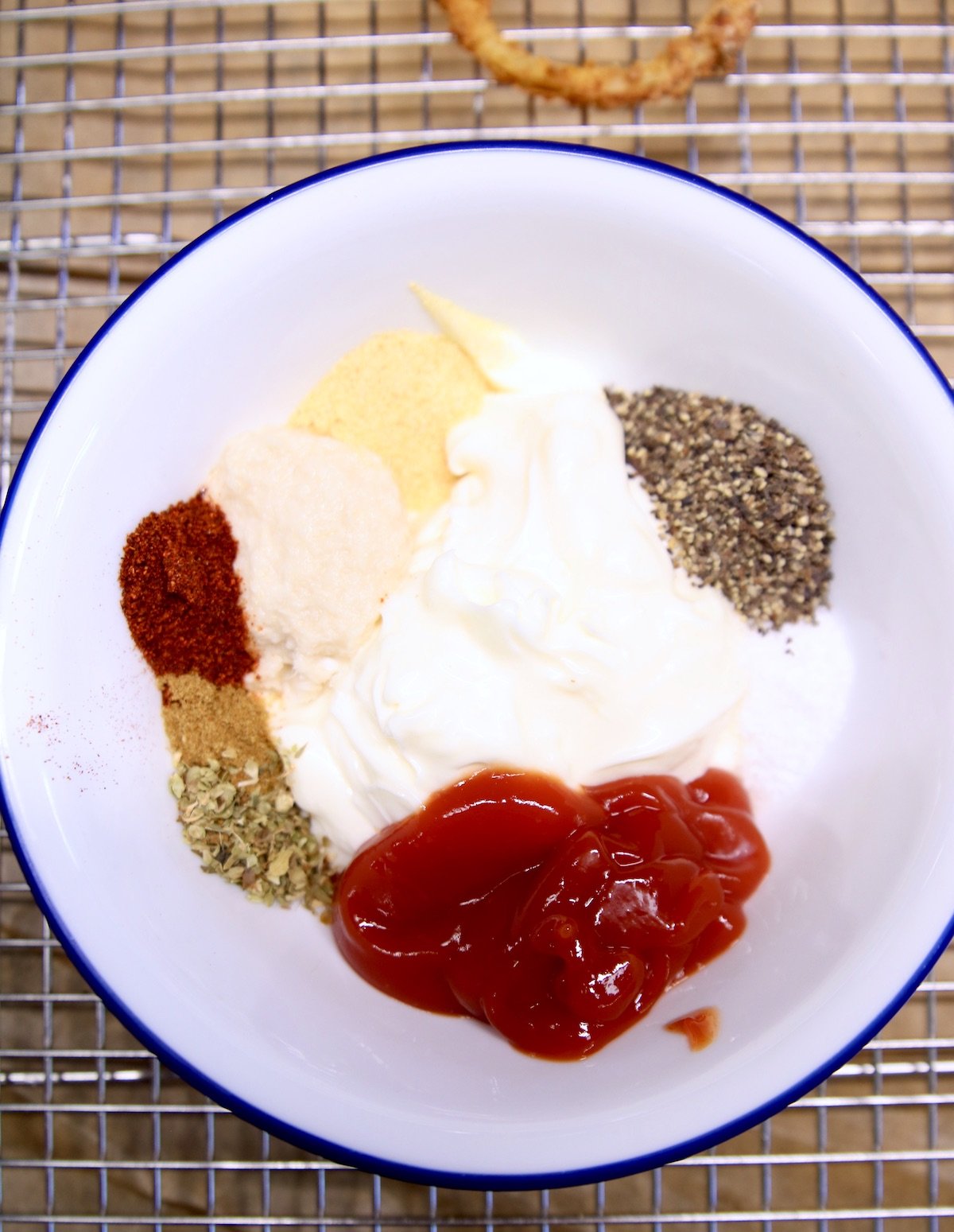 bowl with mayonnaise, ketchup, horseradish and spices