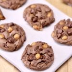 chocolate caramel cookies on a white serving board
