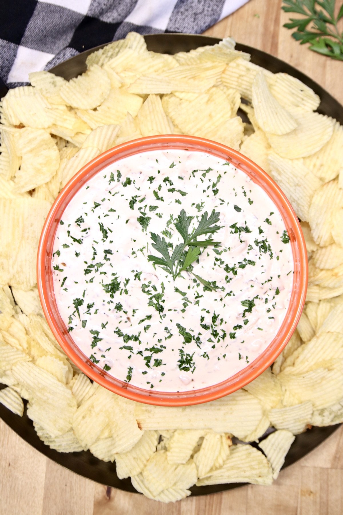 platter of chips with dip in center 