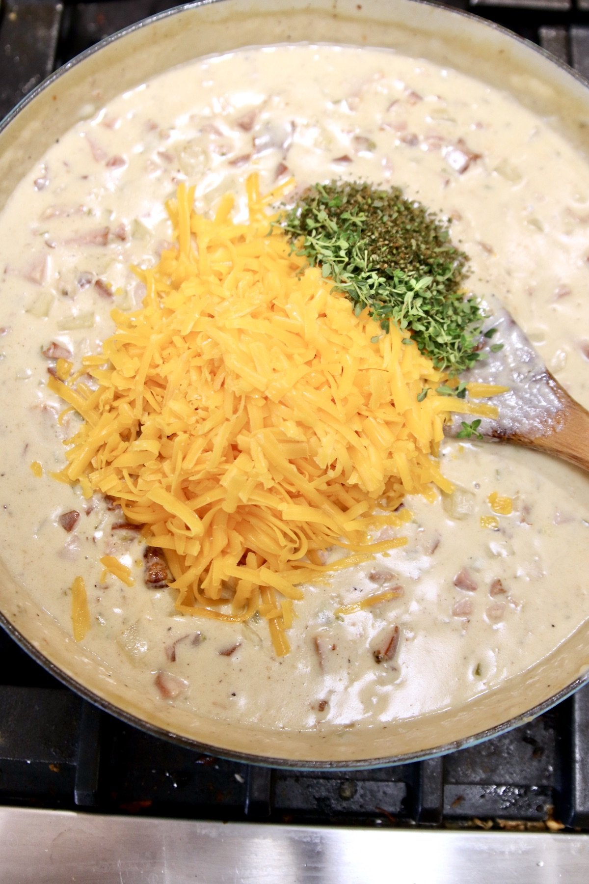 creamy ham soup - adding cheese and herbs
