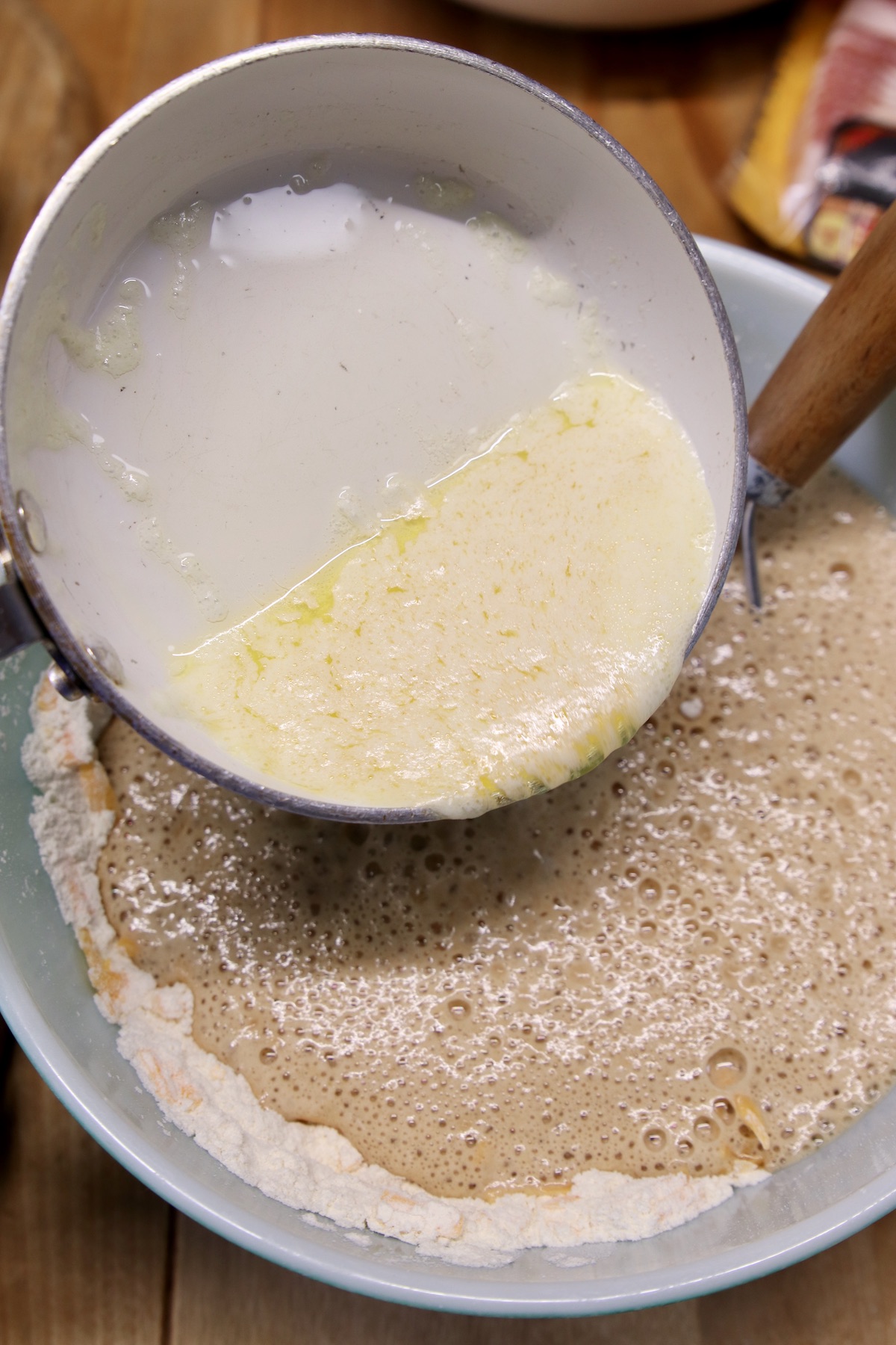 Pouring melted butter into beer bread batter