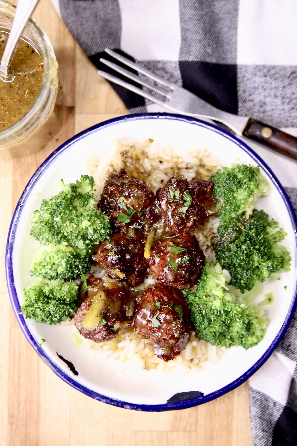 plate of rice with meatballs and broccoli