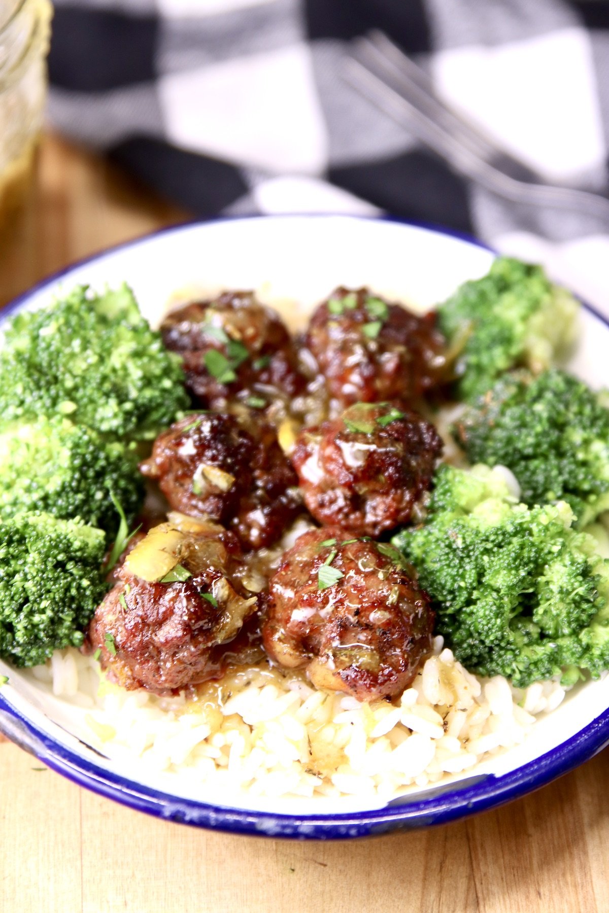 meatballs with orange sauce and broccoli served over rice
