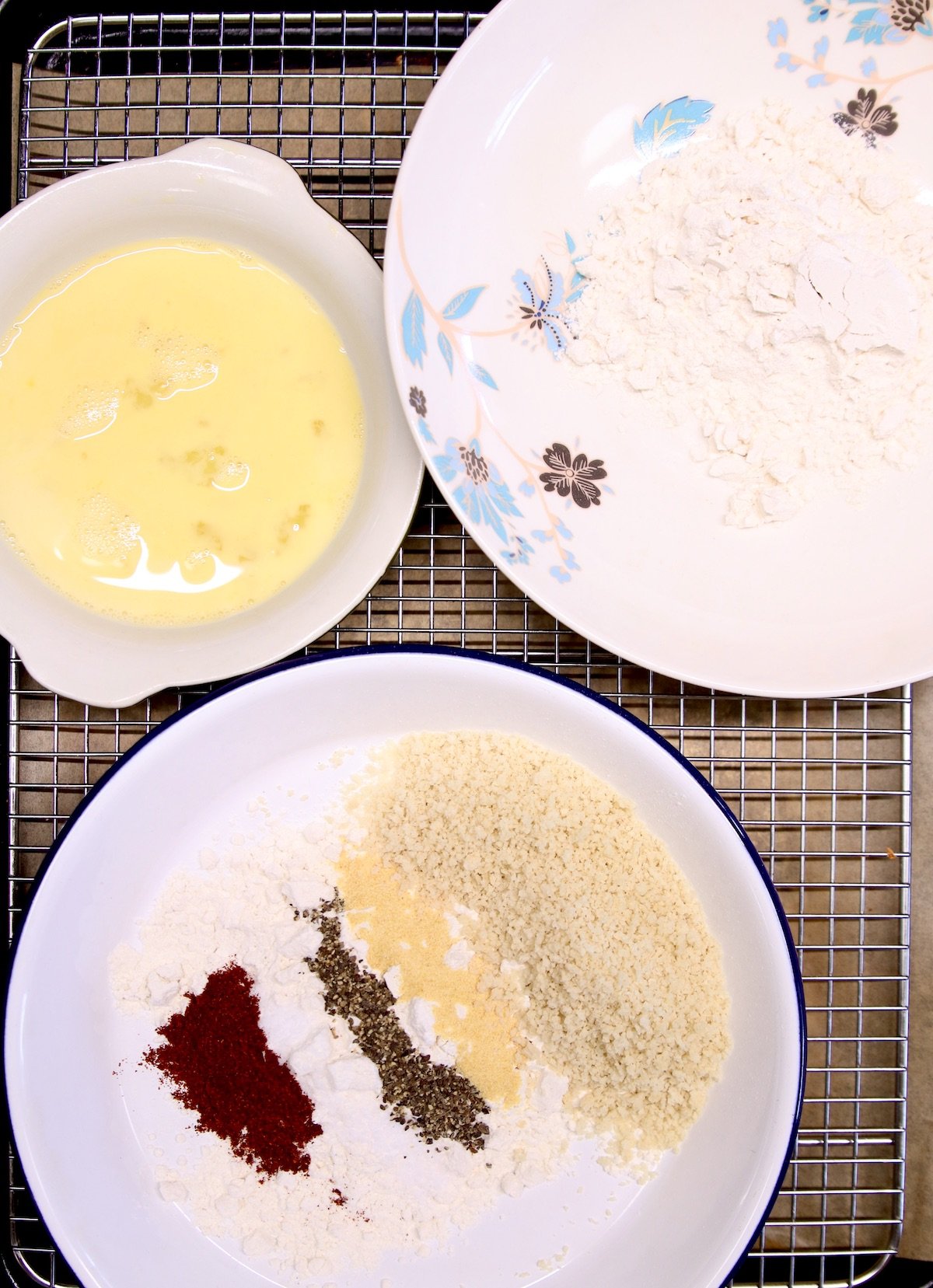 3 bowls - one with egg wash, one with flour, one with breadcrumbs, seasonings, flour