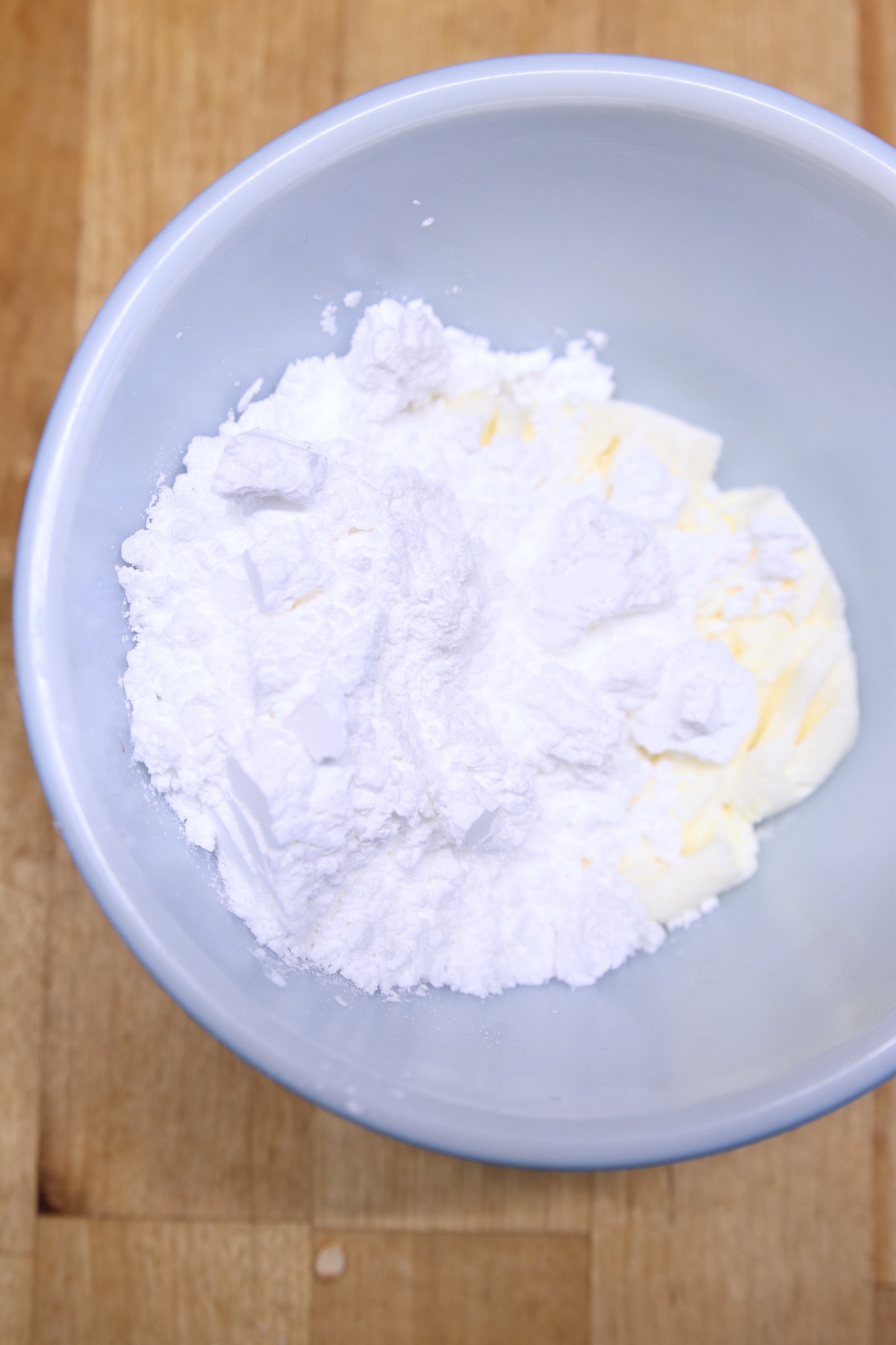bowl of cream cheese and powdered sugar