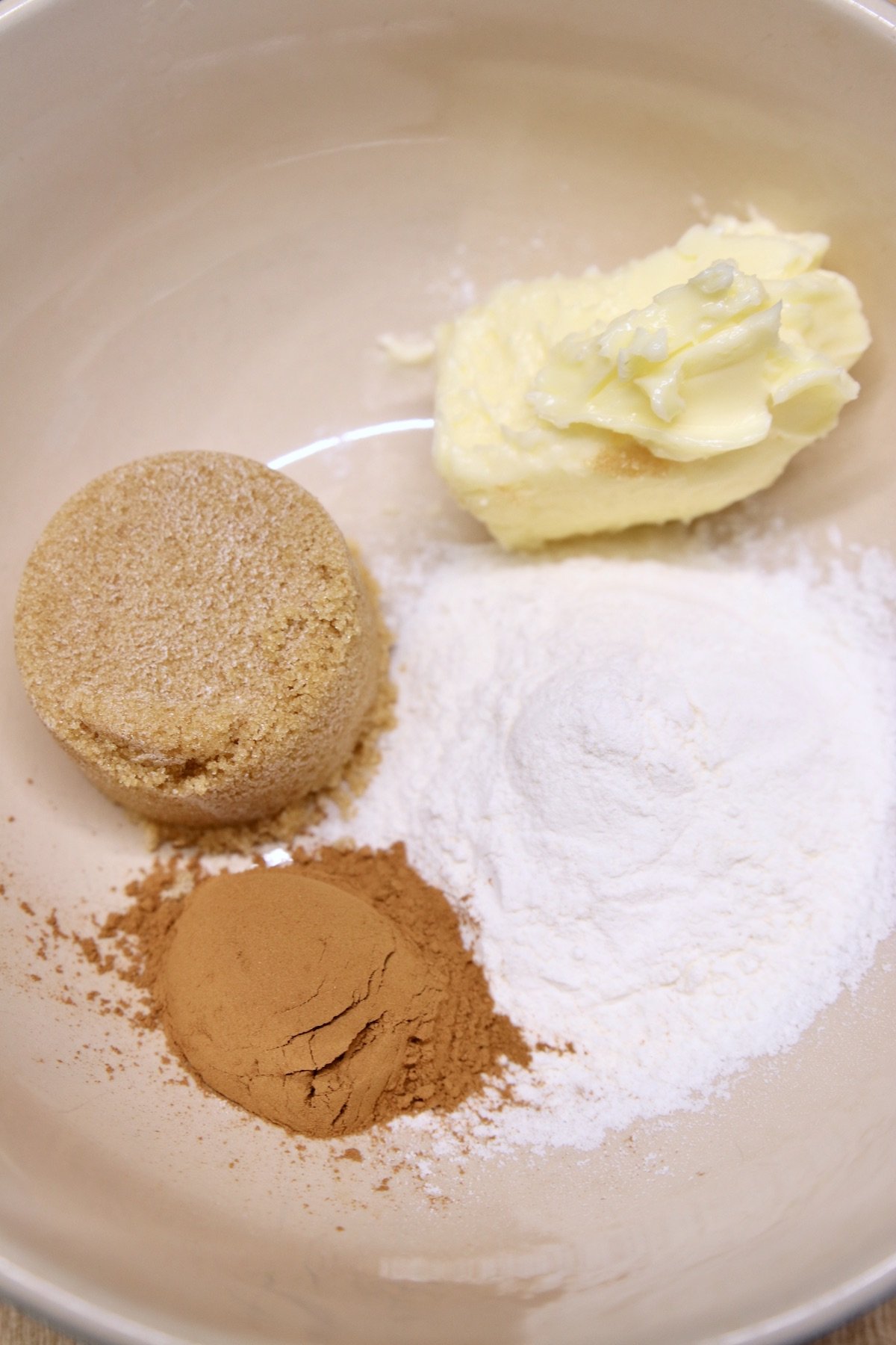 bowl with brown sugar, butter, flour and cinnamon