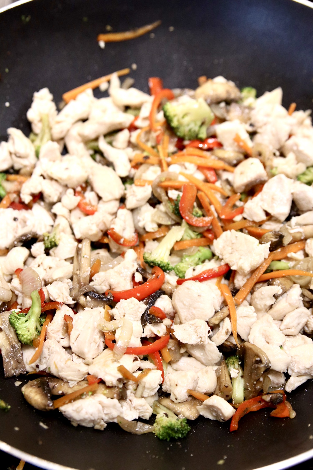 chicken and vegetables in a wok