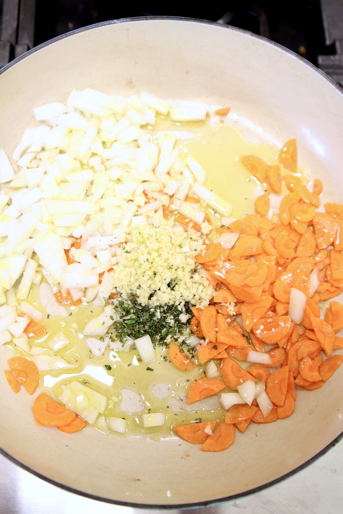 carrots, onions, garlic and rosemary in a large pan