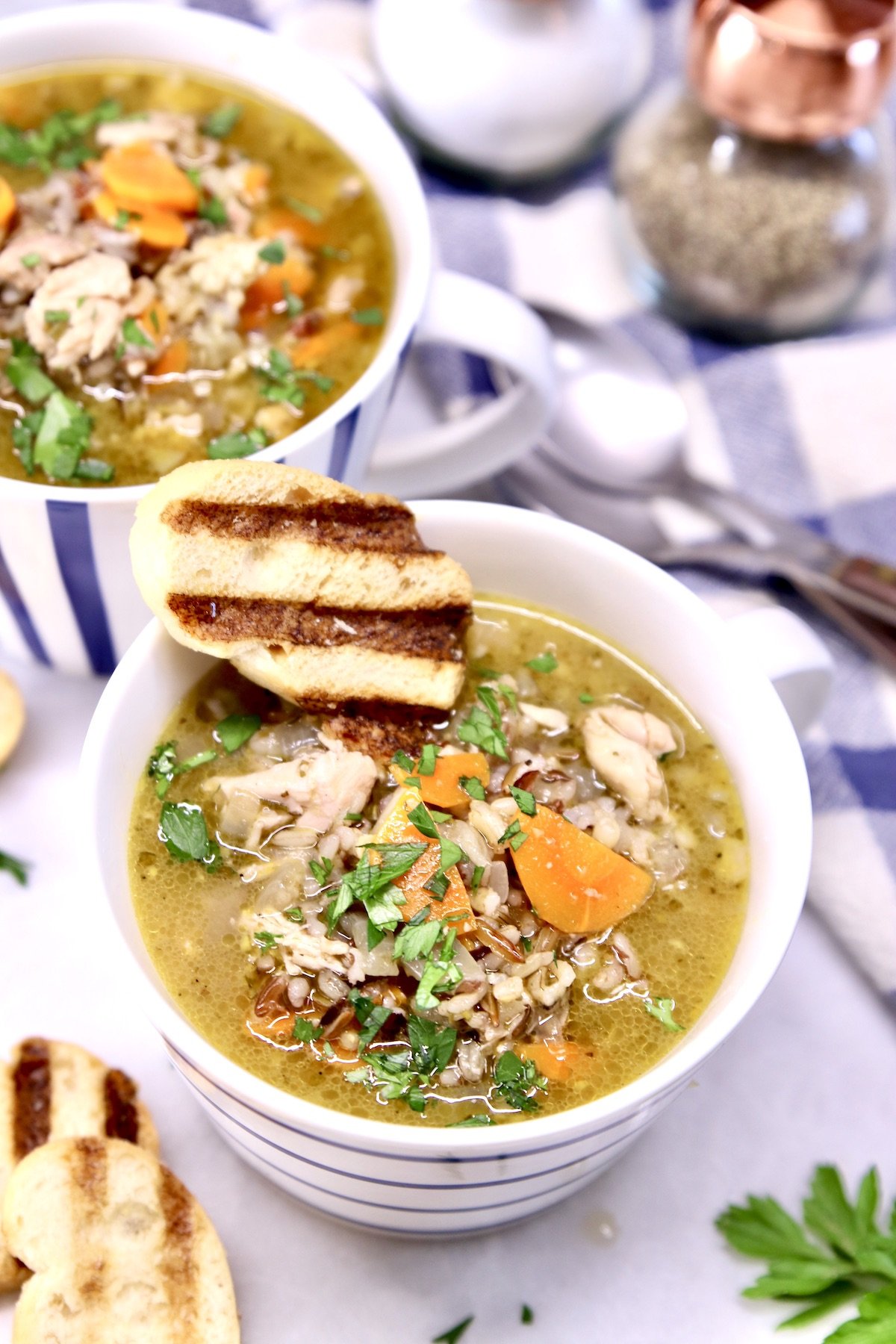 2 soup mugs with chicken and wild rice soup