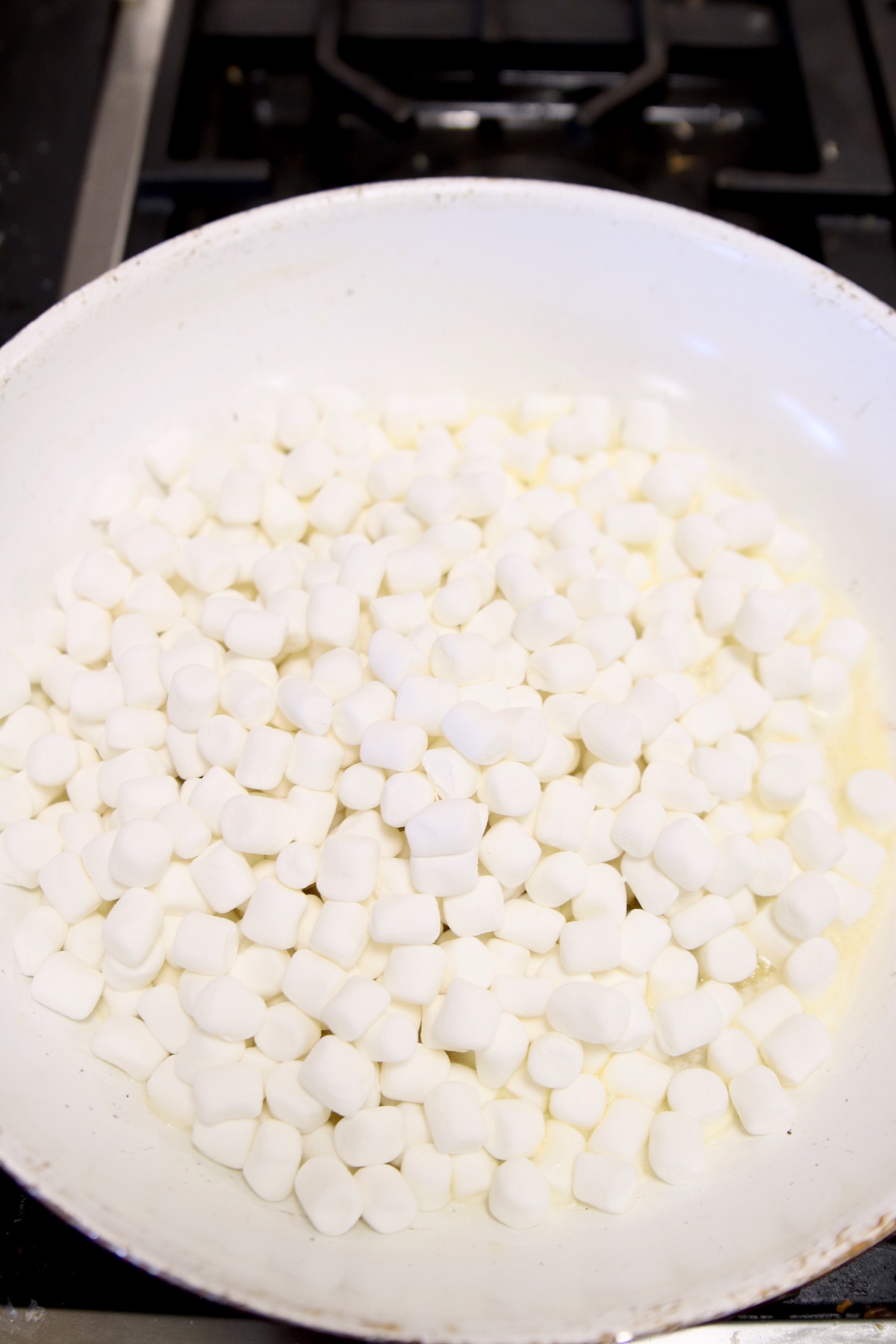 melting marshmallows in a pan
